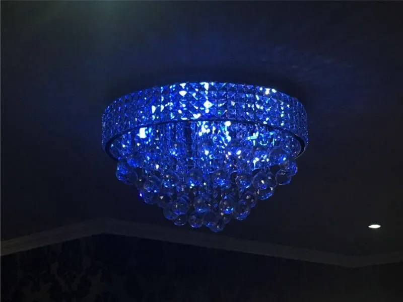 A blue glass chandelier in the dining room