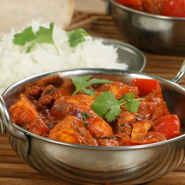 A rich curry served with basmati rice and naan bread