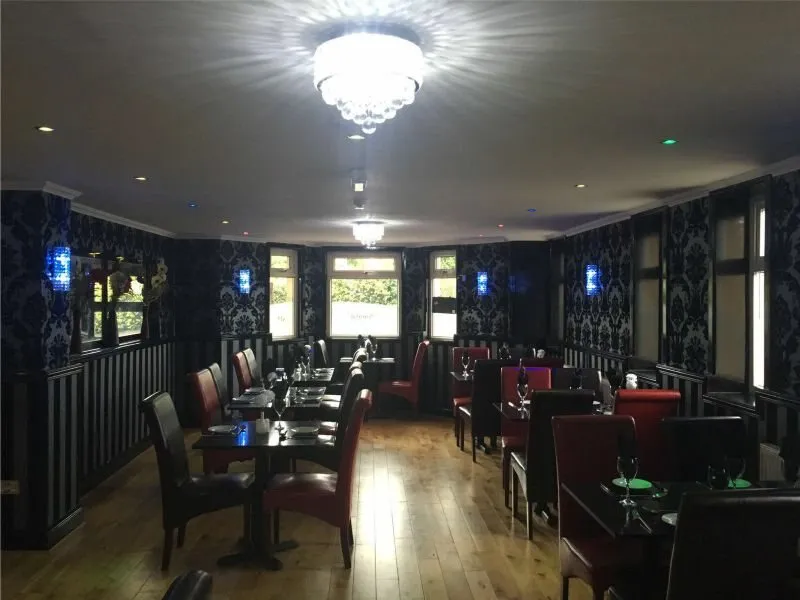 Tables set for dinner in the Mumbai Lounge dining room