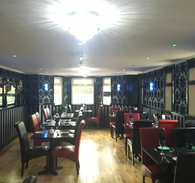 The dining room lit for evening service