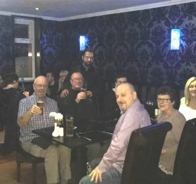 Guests raising a glass together at Mumbai Lounge