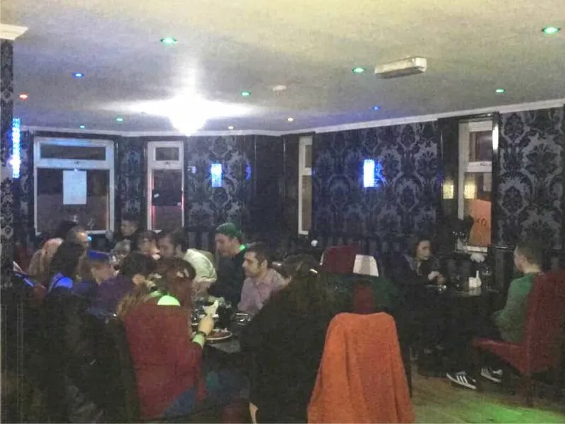 Guests enjoying dinner together at Mumbai Lounge