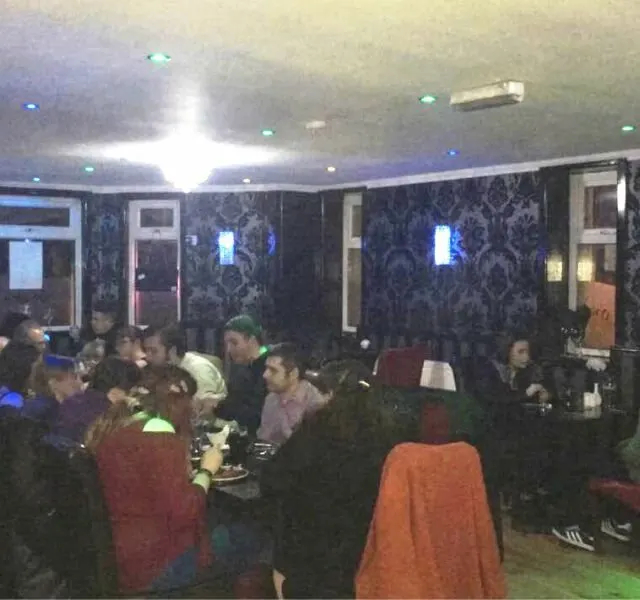 A group of diners enjoying an evening at Mumbai Lounge