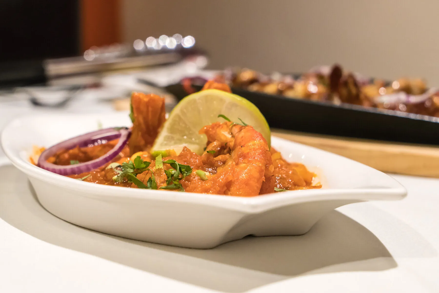 King prawns plated with fresh garnish